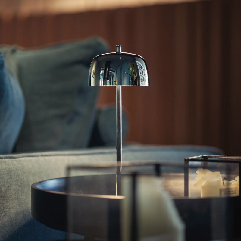 The polished chrome Theta Pro from Zafferano in a den.