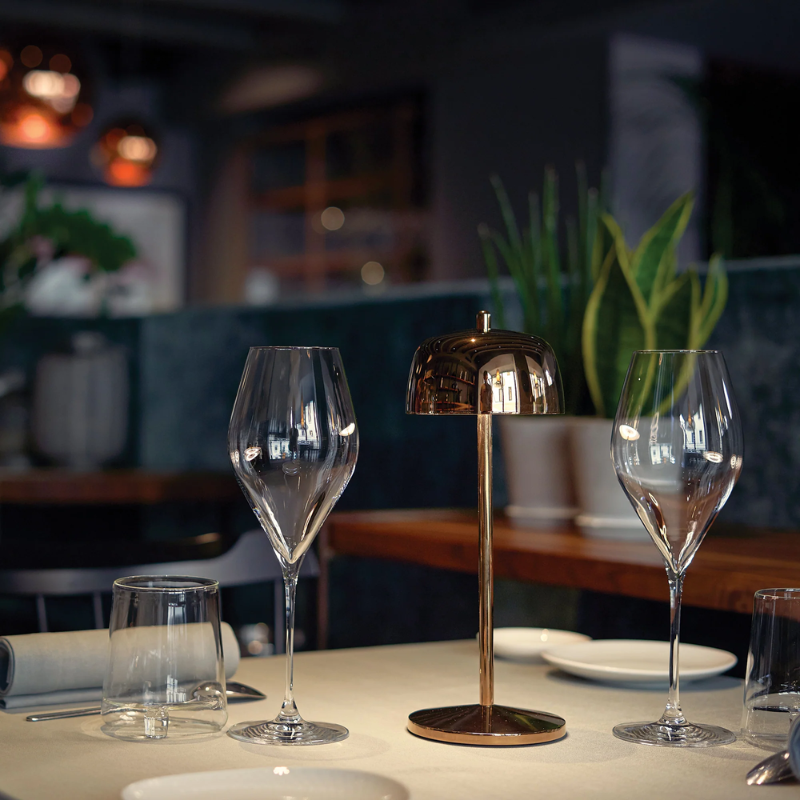 The rose gold Theta Pro from Zafferano in a cafe.