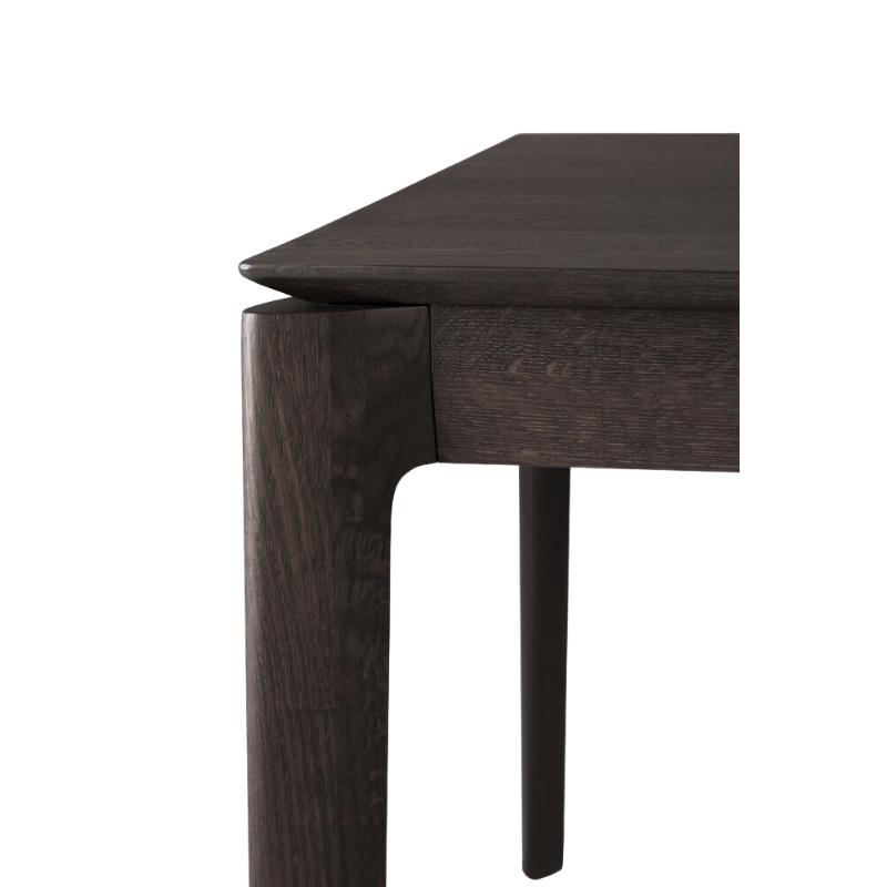 The Bok Dining Table from Ethnicraft in brown oak, close-up.