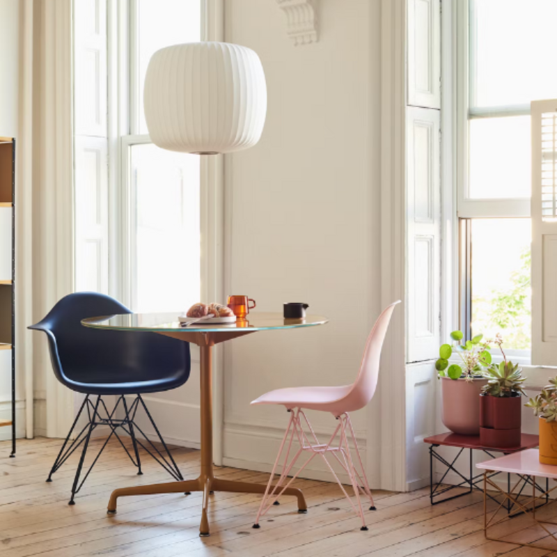The Eames Molded Plastic Side Chair from Herman Miller designed by Herman Miller x HAY in a living room space.