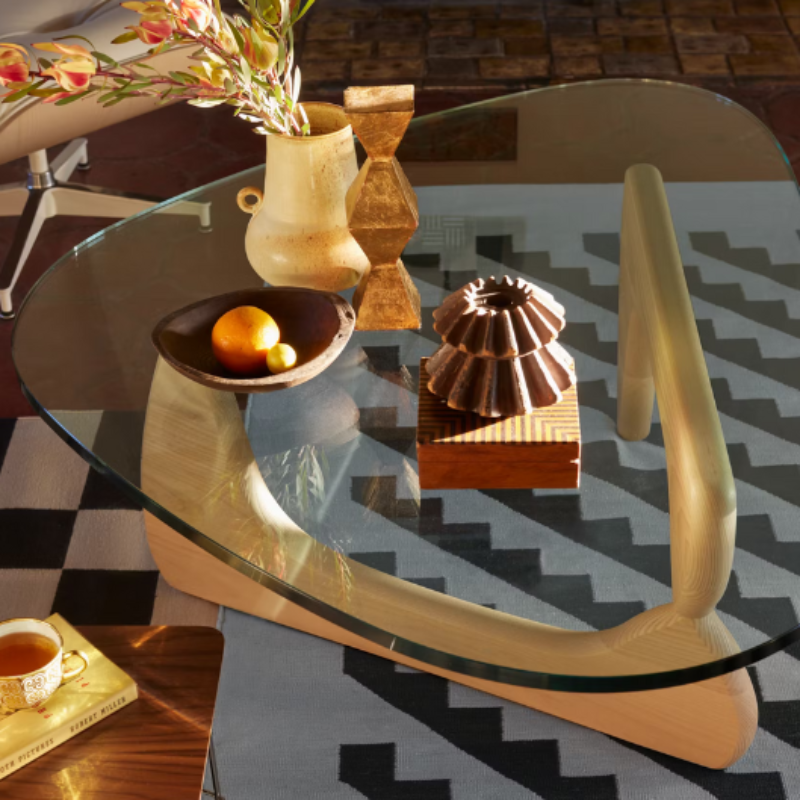 The Noguchi Table from Herman Miller being used as a coffee table.