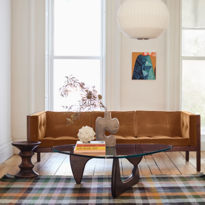 The Noguchi Table from Herman Miller in a den.