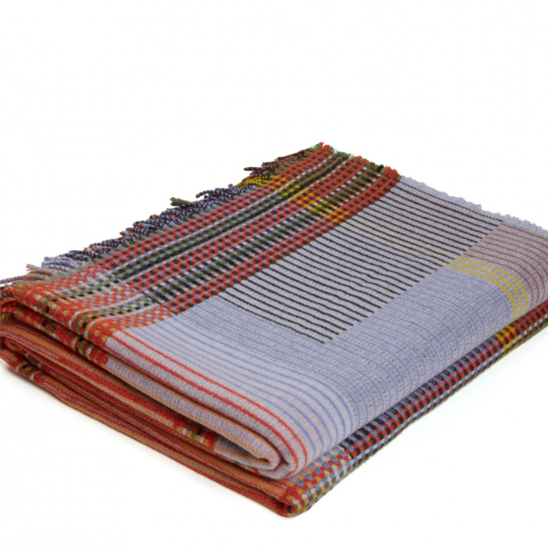 Woven in merino lambswool, Wallace & Sewell's Pinstripe throws combine bold-colored blocks with fine, detailed vertical stripes. This double-sided design also has a contrasting pixelated border and makes a stunning addition to a room.