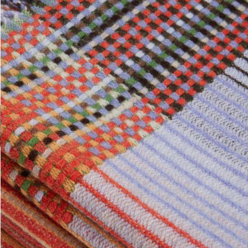 Woven in merino lambswool, Wallace & Sewell's Pinstripe throws combine bold-colored blocks with fine, detailed vertical stripes. This double-sided design also has a contrasting pixelated border and makes a stunning addition to a room.