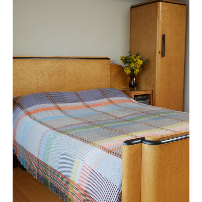 Woven in merino lambswool, Wallace & Sewell's Pinstripe throws combine bold-colored blocks with fine, detailed vertical stripes. This double-sided design also has a contrasting pixelated border and makes a stunning addition to a room.