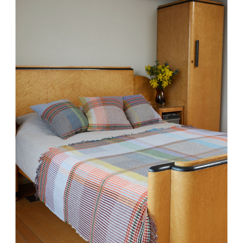 Woven in merino lambswool, Wallace & Sewell's Pinstripe throws combine bold-colored blocks with fine, detailed vertical stripes. This double-sided design also has a contrasting pixelated border and makes a stunning addition to a room.