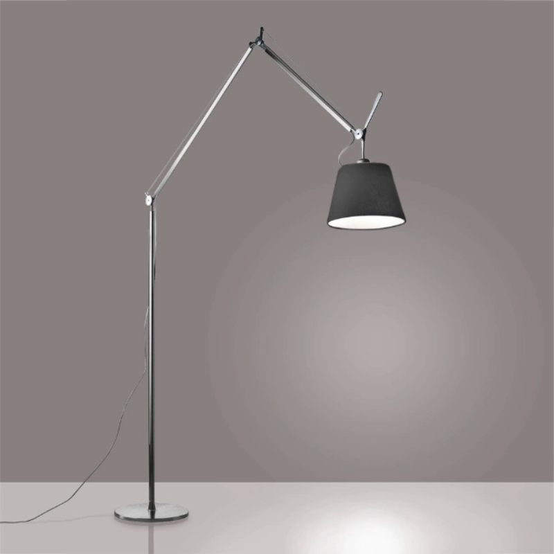The Tolomeo Mega Floor Lamp, Black from Artemide in aluminum in a study room.