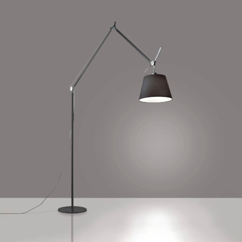 The Tolomeo Mega Floor Lamp, Black from Artemide in black in a living room.