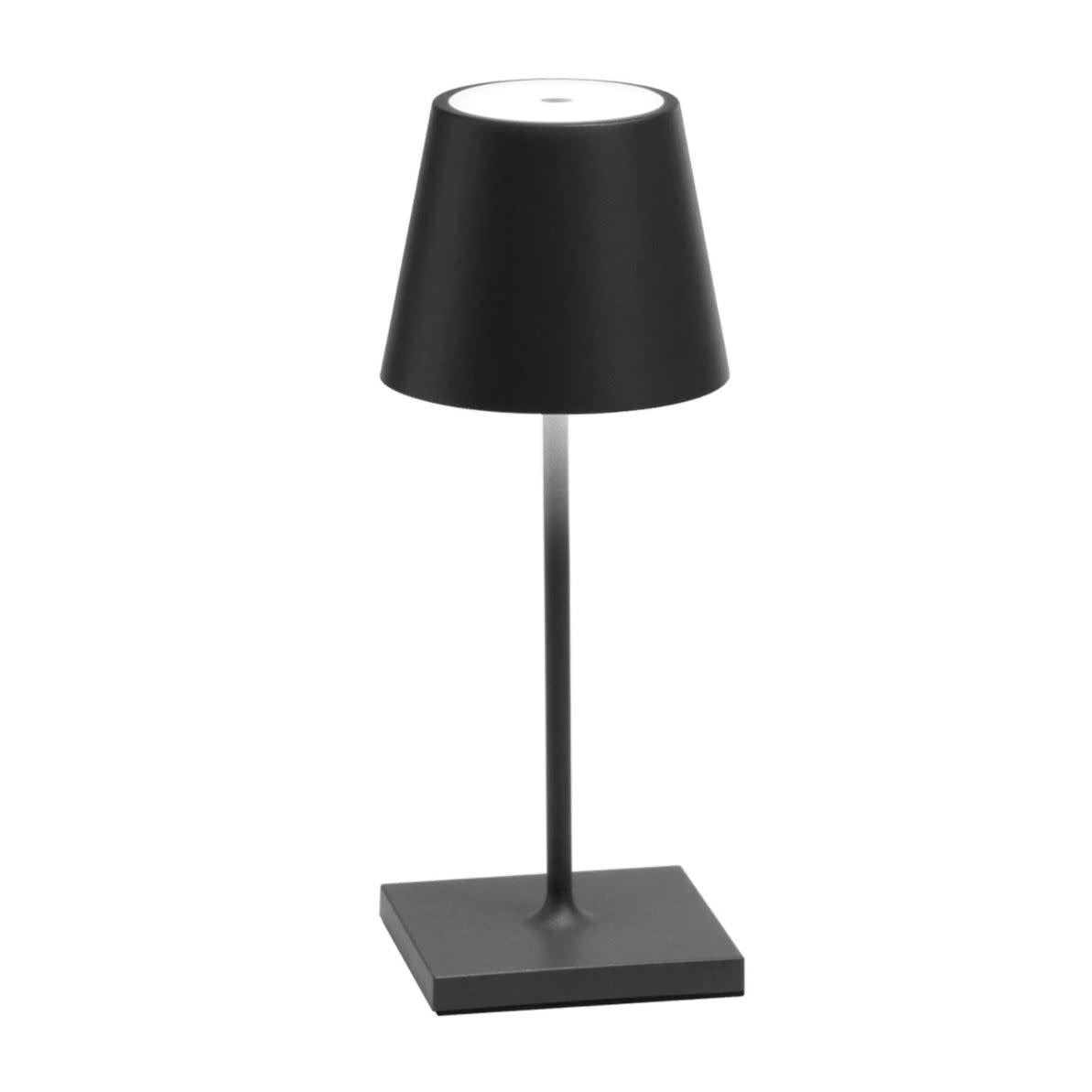The Poldina Mini Table Lamp by Ai Lati Lights for Zafferano features a sleek and small body and offers a crisp and bright light to its setting. Ideal for indoor and outdoor settings with its 9 hour rechargeable battery life and portable body makes the perfect accent to a space. The fixture is made up of painted aluminium with a polycarbonate diffuser and LED light source. Its square base ensures a sturdy display.