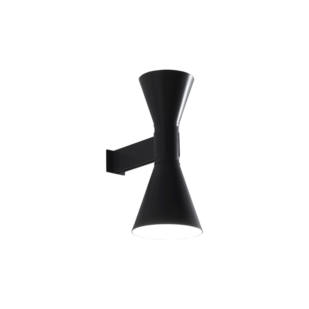 The mini version of the iconic Applique de Marseille, designed by Le Corbusier for his Parisian flat in Rue Nungesser et Coli. This wall lamp provides direct and diffused light through its two cone-shaped lampshades that direct the light up and down, providing homogenous and sharp light beams.
