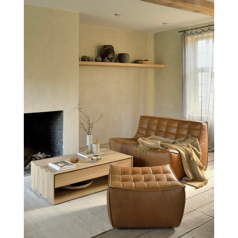 Ethnicraft's Nordic collection combines refined design with the purity of solid wood. The beveled edges give this solid oak furniture an extra edge. The Oak Nordic coffee table conveniently features one storage drawer to stash remotes, coasters, and reading.