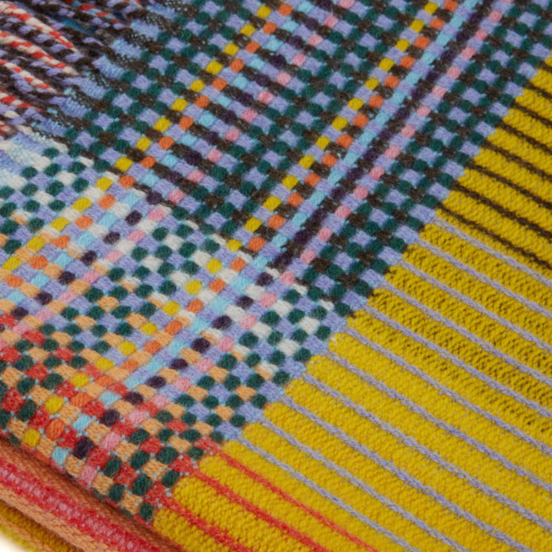 Woven in merino lambswool, Wallace & Sewell's Pinstripe throws combine bold-colored blocks with fine, detailed vertical stripes. This double-sided design also has a contrasting pixelated border and makes a stunning addition to a room.