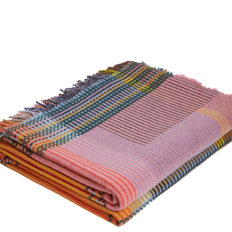 Woven in merino lambswool, Wallace & Sewell's Pinstripe throws combine bold-colored blocks with fine, detailed vertical stripes. This double-sided design also has a contrasting pixelated border and makes a stunning addition to a room.