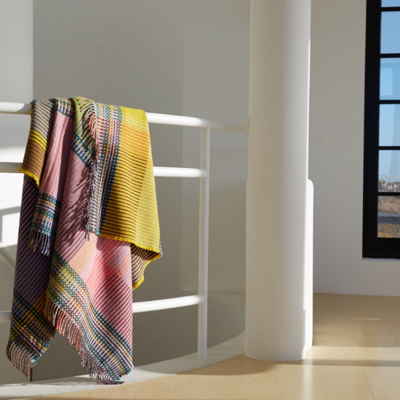 Woven in merino lambswool, Wallace & Sewell's Pinstripe throws combine bold-colored blocks with fine, detailed vertical stripes. This double-sided design also has a contrasting pixelated border and makes a stunning addition to a room.