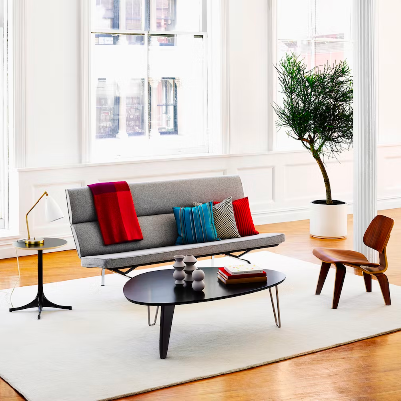 Balanced on two hairpin chrome legs and a single wooden "rudder," the wood top of the Noguchi Rudder Table (1949) seems to float airily in space. This wood and metal leg coffee table is available in three finishes and is an authentic Noguchi design created for Herman Miller.
