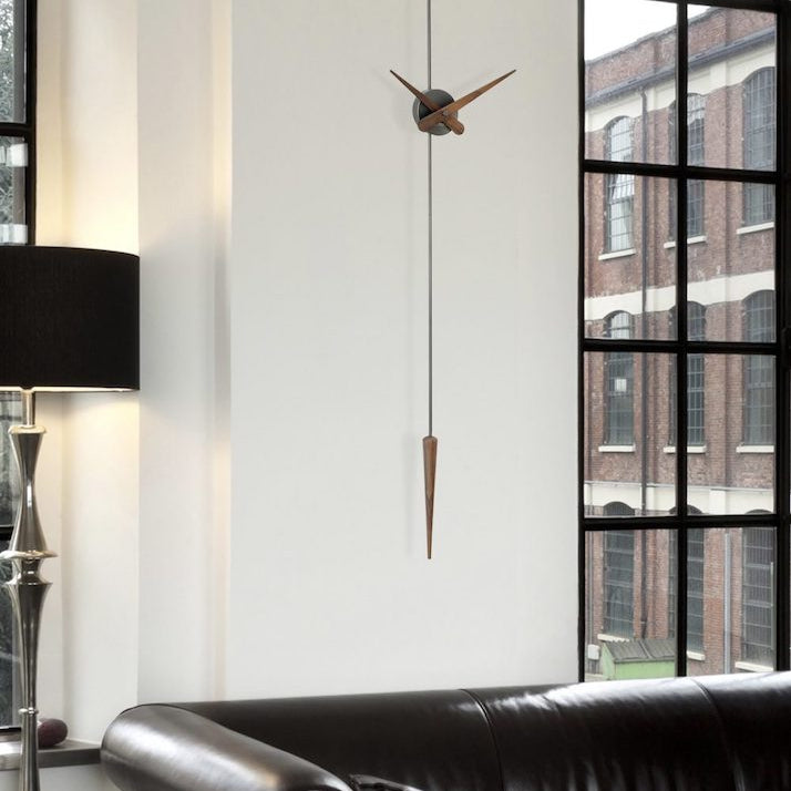 The Punto y Coma Clock has a great personality and a contemporary design, which reinterprets the classic pendulum clock.