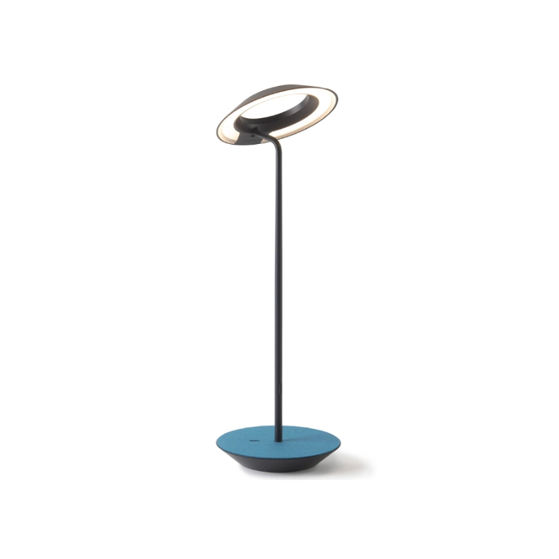 A simultaneously retro and modern desk lamp that combines elegance and inviting warmth. The Royyo Desk Lamp by Koncept will bring whimsy and charm to your desk, as well as super useful and energy-efficient LED illumination. Inventive simplicity is the value that holds together each piece of the desk lamp’s aesthetic, with a somewhat conical shade held at a distinct angle by a thin Aluminum stem. This is contrasted neatly by a distinctively shaped base.