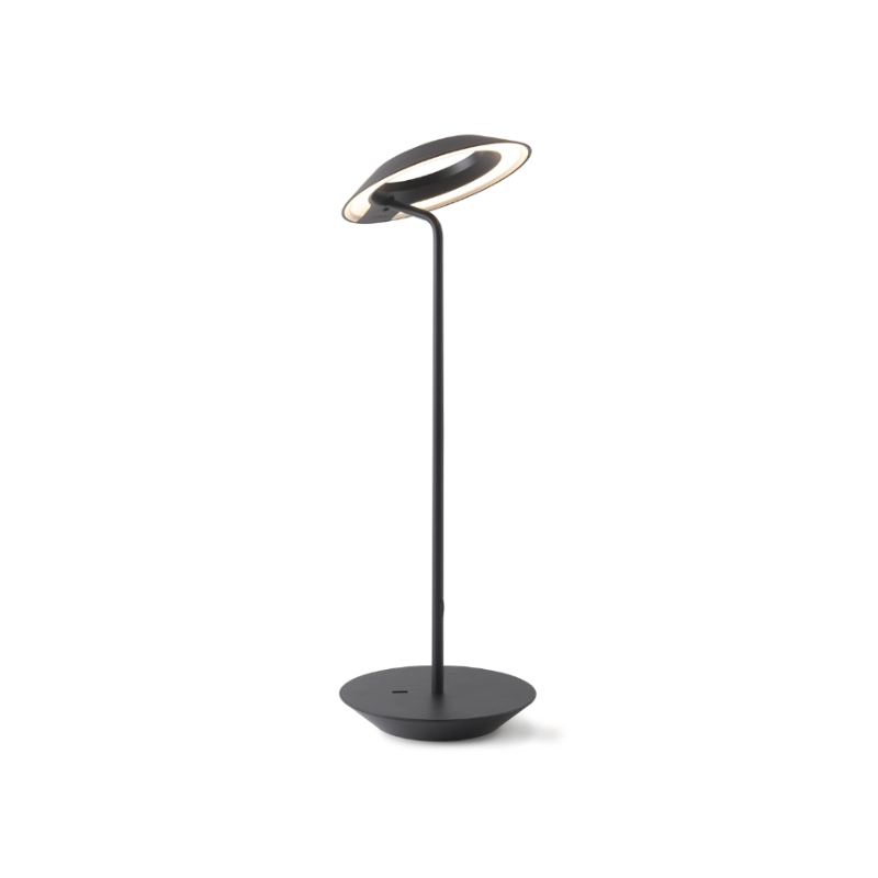 A simultaneously retro and modern desk lamp that combines elegance and inviting warmth. The Royyo Desk Lamp by Koncept will bring whimsy and charm to your desk, as well as super useful and energy-efficient LED illumination. Inventive simplicity is the value that holds together each piece of the desk lamp’s aesthetic, with a somewhat conical shade held at a distinct angle by a thin Aluminum stem. This is contrasted neatly by a distinctively shaped base.