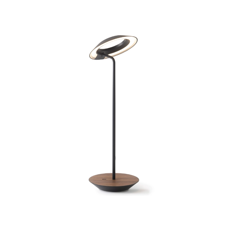 A simultaneously retro and modern desk lamp that combines elegance and inviting warmth. The Royyo Desk Lamp by Koncept will bring whimsy and charm to your desk, as well as super useful and energy-efficient LED illumination. Inventive simplicity is the value that holds together each piece of the desk lamp’s aesthetic, with a somewhat conical shade held at a distinct angle by a thin Aluminum stem. This is contrasted neatly by a distinctively shaped base.
