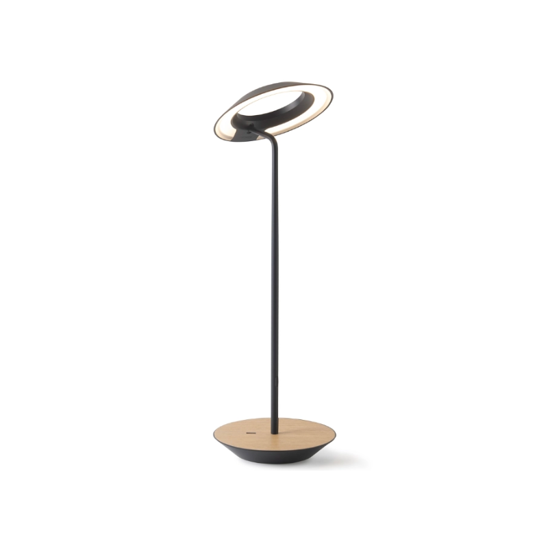 A simultaneously retro and modern desk lamp that combines elegance and inviting warmth. The Royyo Desk Lamp by Koncept will bring whimsy and charm to your desk, as well as super useful and energy-efficient LED illumination. Inventive simplicity is the value that holds together each piece of the desk lamp’s aesthetic, with a somewhat conical shade held at a distinct angle by a thin Aluminum stem. This is contrasted neatly by a distinctively shaped base.