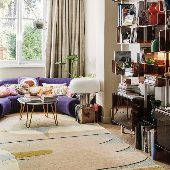 The Sirocco area rug displays a composition of curves and colors inspired by the lands of the Mediterranean. A game of shadows and transparencies, the organic design unfolds in all subtlety. Hand-tufted in a New Zealand wool blend, the pile of this rug is comfortable, yet can adapt to the busiest spaces.