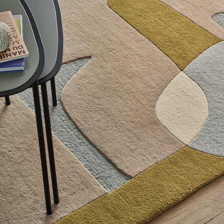 The Sirocco area rug displays a composition of curves and colors inspired by the lands of the Mediterranean. A game of shadows and transparencies, the organic design unfolds in all subtlety. Hand-tufted in a New Zealand wool blend, the pile of this rug is comfortable, yet can adapt to the busiest spaces.