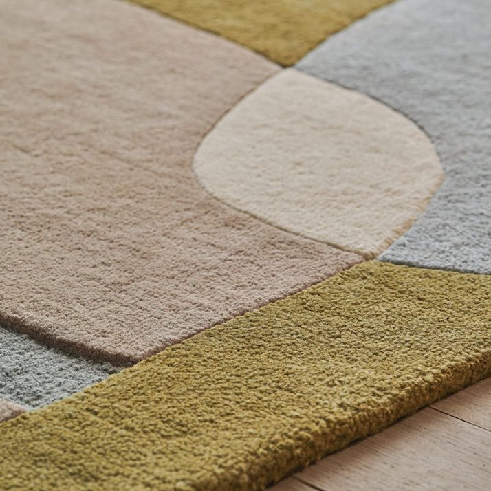 The Sirocco area rug displays a composition of curves and colors inspired by the lands of the Mediterranean. A game of shadows and transparencies, the organic design unfolds in all subtlety. Hand-tufted in a New Zealand wool blend, the pile of this rug is comfortable, yet can adapt to the busiest spaces.