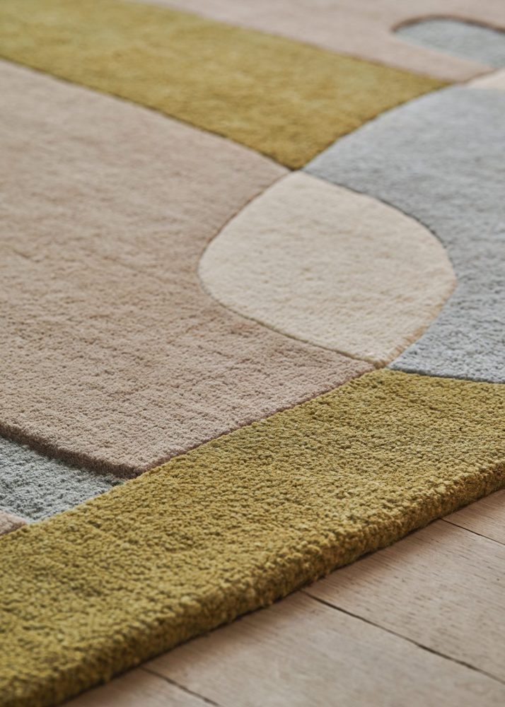 The Sirocco area rug displays a composition of curves and colors inspired by the lands of the Mediterranean. A game of shadows and transparencies, the organic design unfolds in all subtlety. Hand-tufted in a New Zealand wool blend, the pile of this rug is comfortable, yet can adapt to the busiest spaces.
