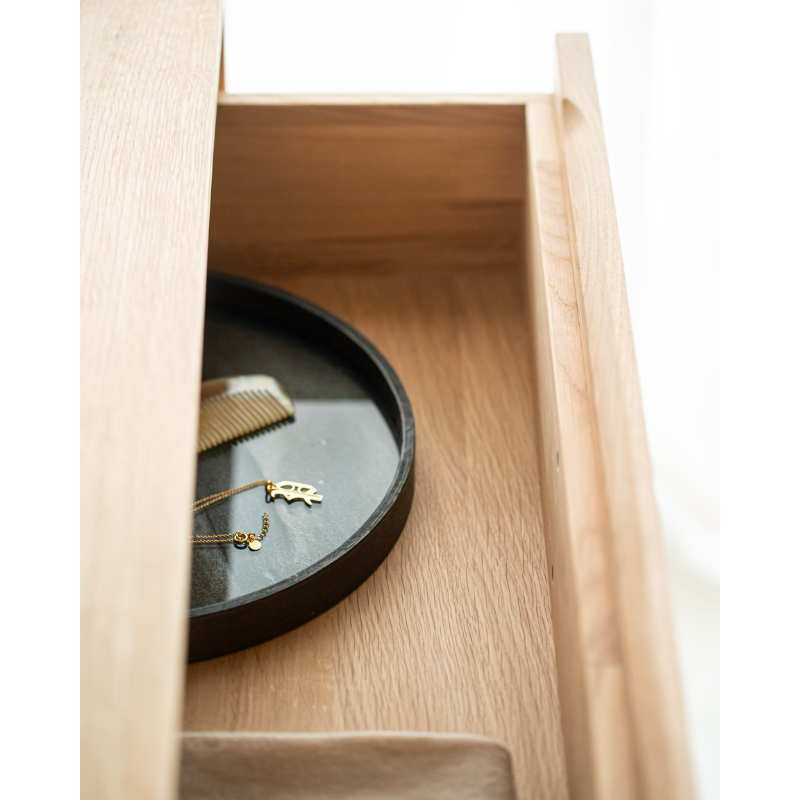The Wave Sideboard by Ethnicraft features contoured cabinet doors and a distinguished shape to the feet. Made of solid wood, this cabinet’s doors and drawers have no handles and feature a soft closing mechanism. Being used as bedroom storage