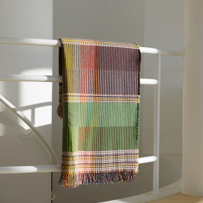 Woven in merino lambswool, Wallace & Sewell's Pinstripe throws combine bold-colored blocks with fine, detailed vertical stripes. This double-sided design also has a contrasting pixelated border and makes a stunning addition to a room.