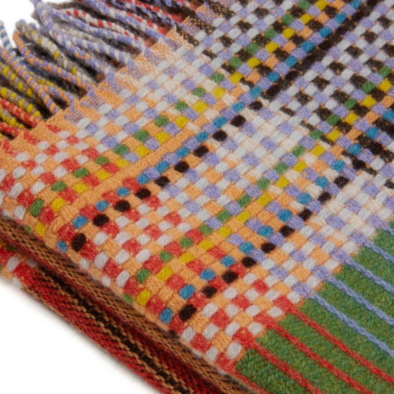 Woven in merino lambswool, Wallace & Sewell's Pinstripe throws combine bold-colored blocks with fine, detailed vertical stripes. This double-sided design also has a contrasting pixelated border and makes a stunning addition to a room.