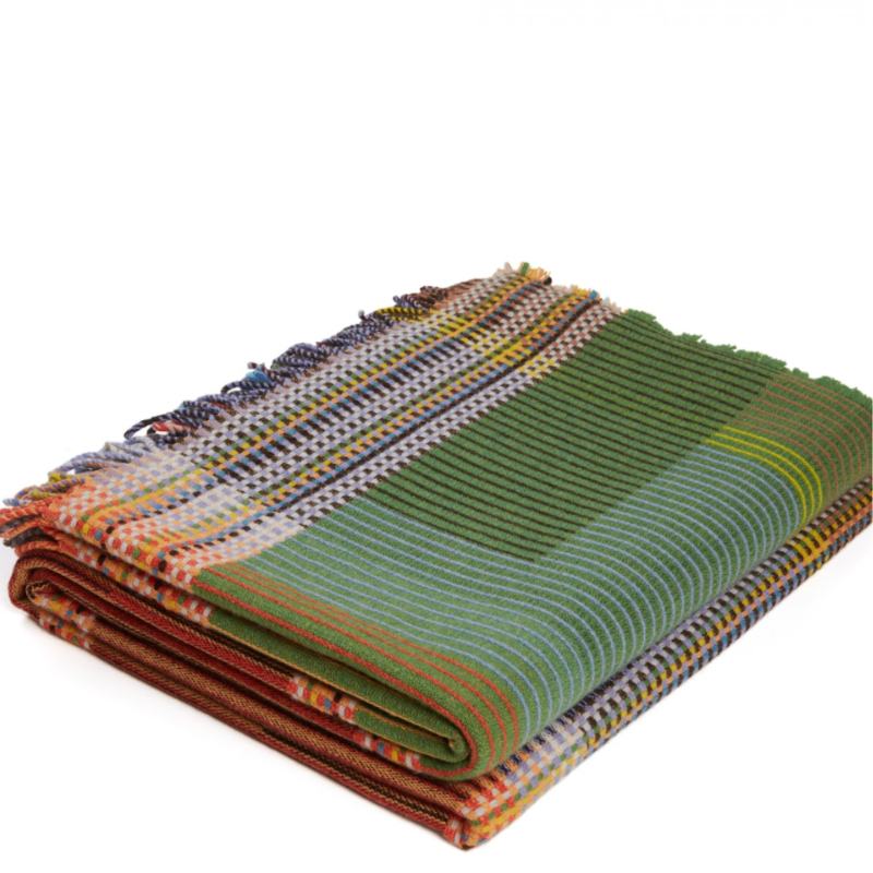 Woven in merino lambswool, Wallace & Sewell's Pinstripe throws combine bold-colored blocks with fine, detailed vertical stripes. This double-sided design also has a contrasting pixelated border and makes a stunning addition to a room.