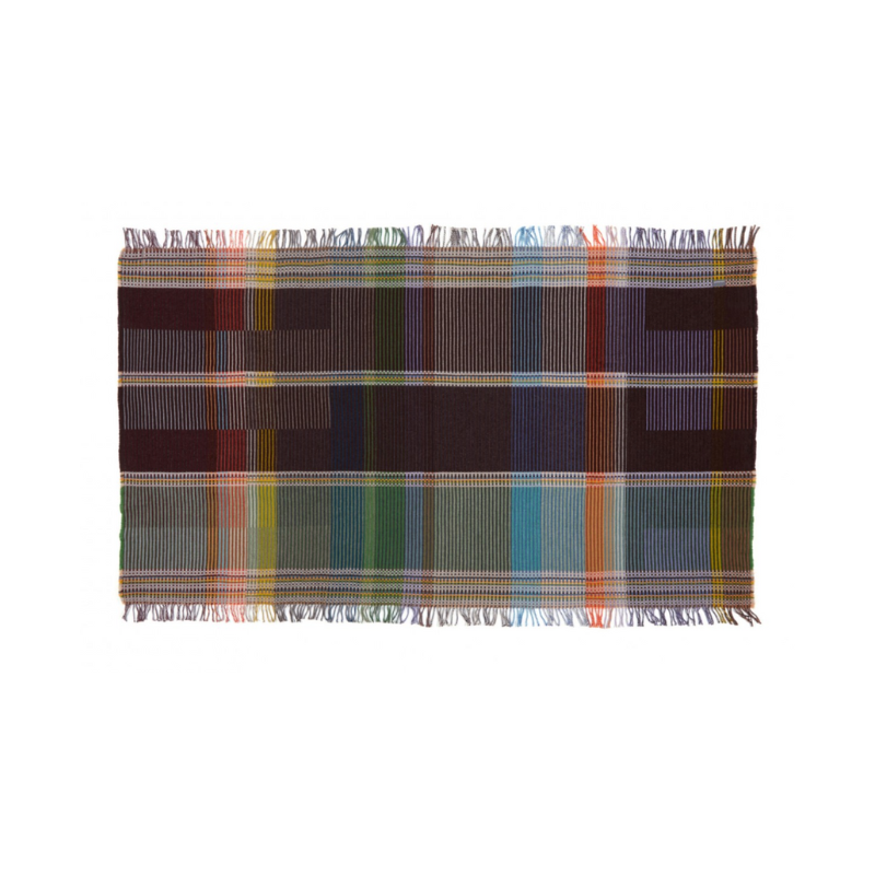 Woven in merino lambswool, Wallace & Sewell's Pinstripe throws combine bold-colored blocks with fine, detailed vertical stripes. This double-sided design also has a contrasting pixelated border and makes a stunning addition to a room.