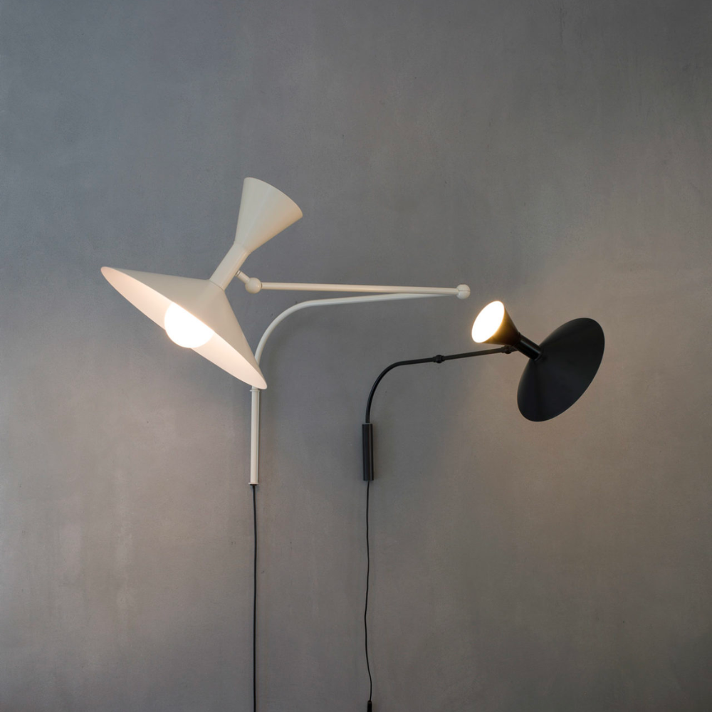 Designed by Le Corbusier for the Unité d Habitation of Marseille in 1949/1952, the Lampe de Marseille wall lamp from Nemo features adjustable lighting via its two joints on the arm with a refined aesthetic.