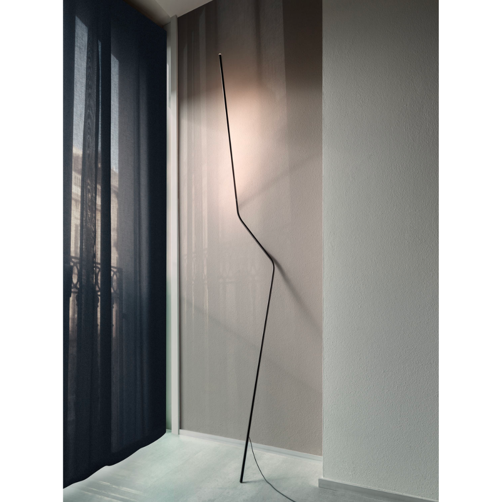 Make a statement or blend in, the NEO LED Floor Lamp, designed by Bernhard Ossan for Nemo, presents a refined fixture for modern spaces. Composed of a single steel beam, this fixture rests against the wall as a slender vertical structure.