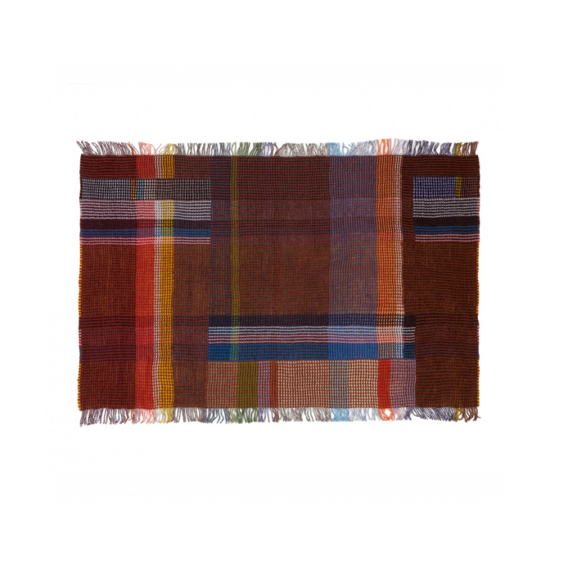 The Edith Honeycomb Throw from Wallace & Sewell made from 100% merino lambswool in the United Kingdom.