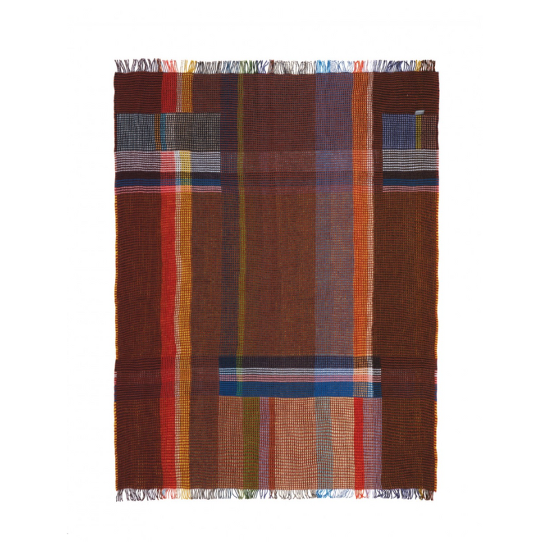 The Edith Honeycomb Throw from Wallace & Sewell made from 100% merino lambswool in the United Kingdom.