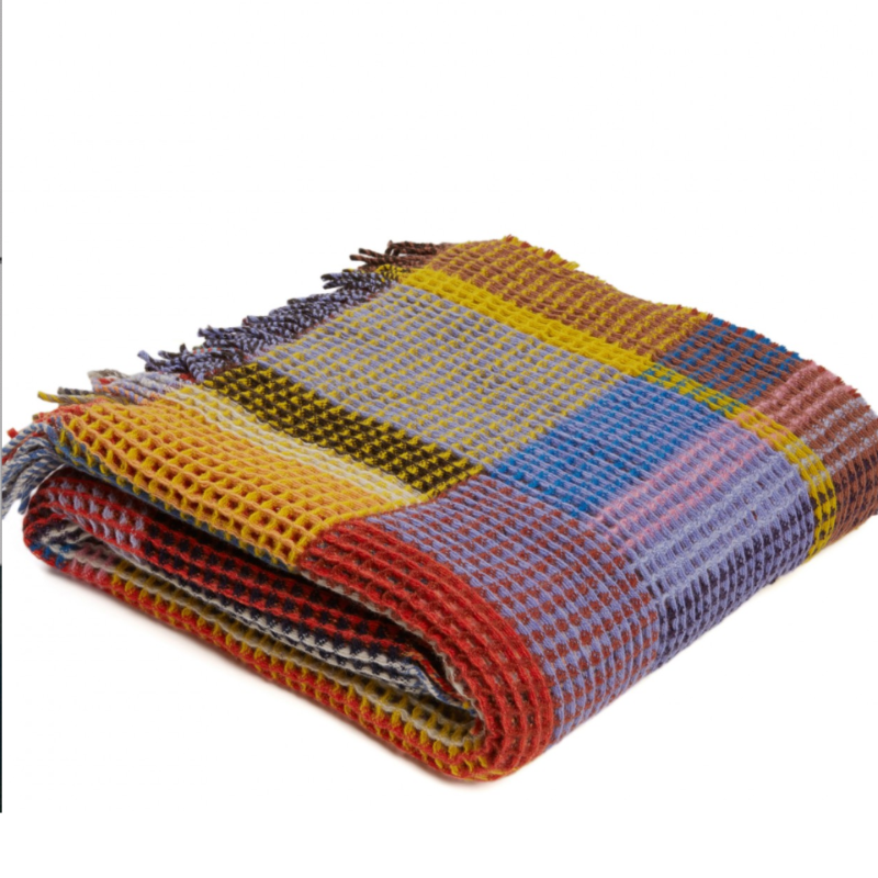 The Edith Honeycomb Throw from Wallace & Sewell made from 100% merino lambswool in the United Kingdom.