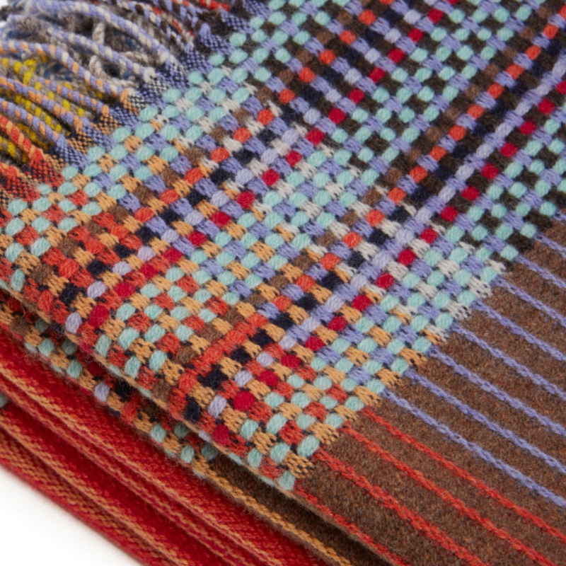 Woven in merino lambswool, Wallace & Sewell's Pinstripe throws combine bold-colored blocks with fine, detailed vertical stripes. This double-sided design also has a contrasting pixelated border and makes a stunning addition to a room.