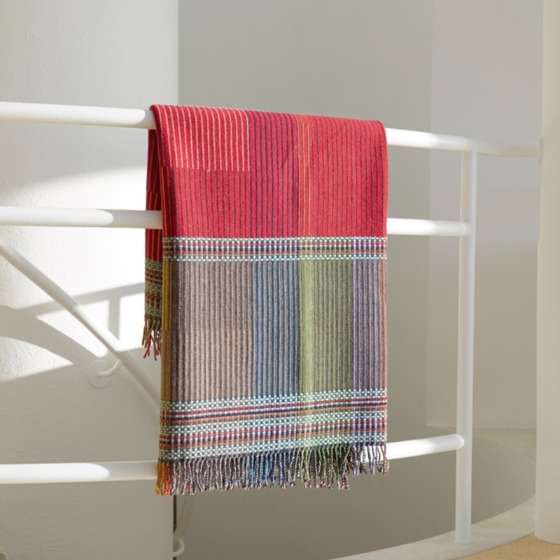 Woven in merino lambswool, Wallace & Sewell's Pinstripe throws combine bold-colored blocks with fine, detailed vertical stripes. This double-sided design also has a contrasting pixelated border and makes a stunning addition to a room.