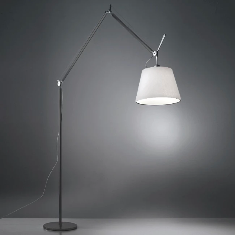 The Tolomeo Mega Floor Lamp from Artemide in parchment with a 17-inch shade in an office space.