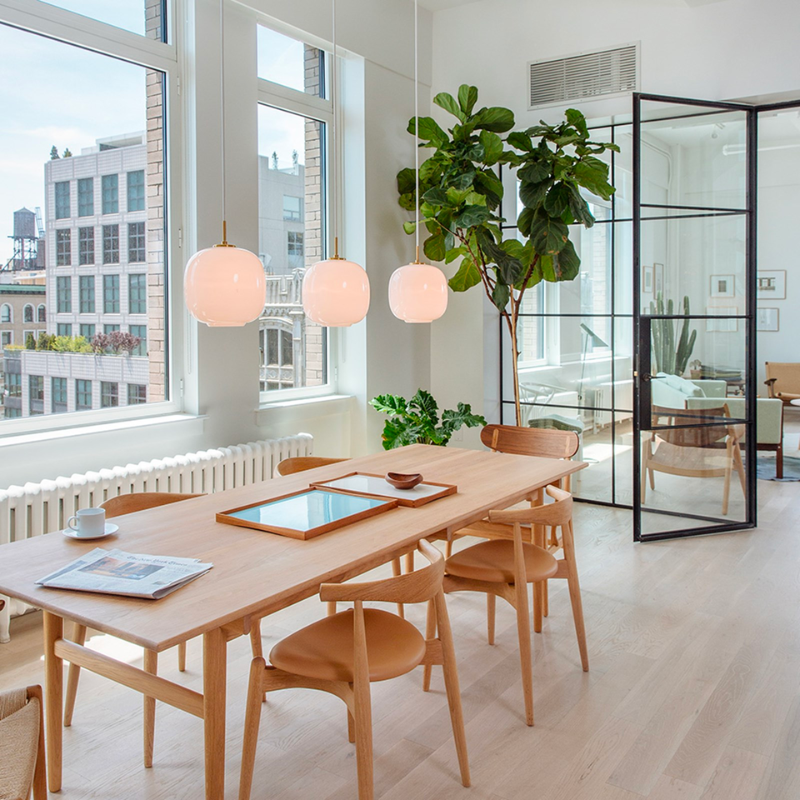 Originally designed in the 1940s by Vilhelm Lauritzen for a project in Copenhagen, the Louis Poulsen VL45 Radiohus Pendant is everything we love about modern design. The lantern shape is smooth and crisply rendered from three layers of hand-blown glass, casting a glowing light from its center that is both functional and beautiful to witness. The glass is topped with a Brushed Brass tube, adding a nice metallic accent to the warmth of the opal glass.
