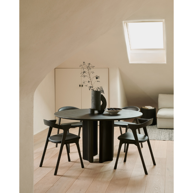 The Roller Max Dining Table from Ethnicraft in a dining room.