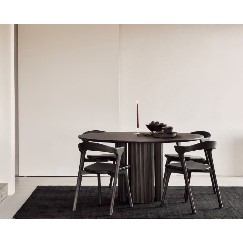 The Roller Max Dining Table from Ethnicraft in a living room lifestyle photograph.