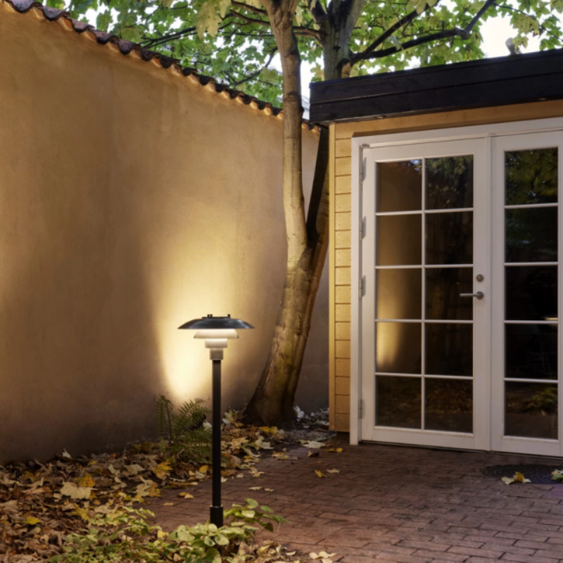 The PH 3-2½ Bollard from Louis Poulsen outside a home.
