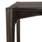 The Teak Dark Brown PI Dining Table by Ethnicraft from the corner in detail. all-groups