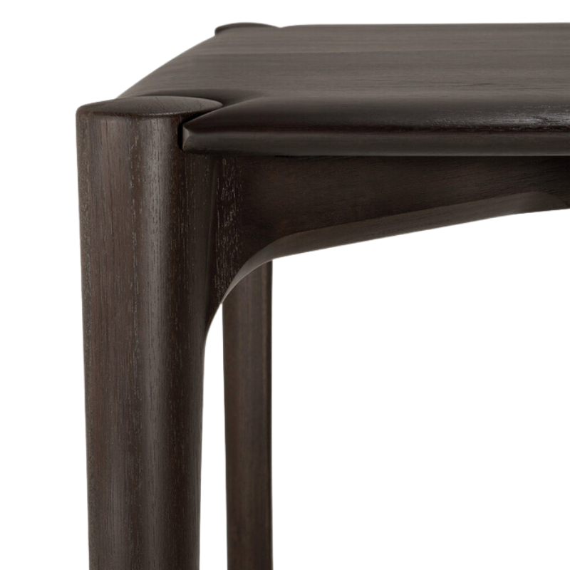The Teak Dark Brown PI Dining Table by Ethnicraft from the corner in detail. all-groups