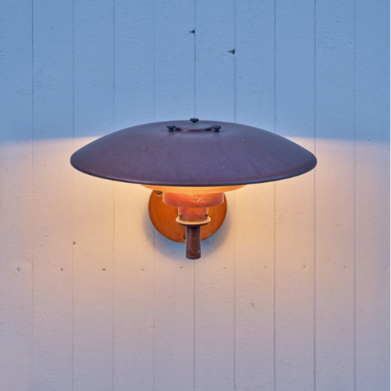 The PH Wall from Louis Poulsen used as an outdoor wall sconce.