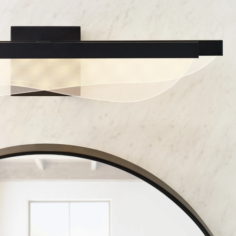 The Nyra Bathroom Sconce from Visual Comfort and Co in a close up photograph.