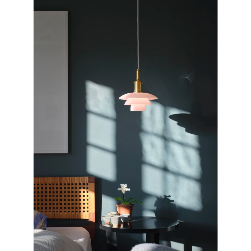 the PH 3/3 Pale Rose Pendant boasts beautiful, mouthblown pale rose glass shades, that are sandblasted on the underside to provide optimal light.